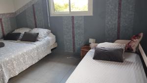 Letto o letti in una camera di "Le champs" des oiseaux