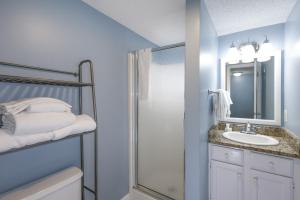 a bathroom with a shower and a sink at Sugar Beach 353 in Gulf Shores