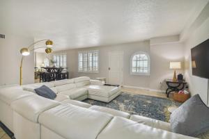 a white living room with a white couch at Bayside Penthouse-5min to Beach, Rest & Shops in Clearwater Beach