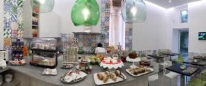 a counter with many plates of food on it at Sorrento Flats in Sorrento