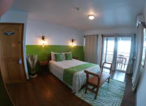 Ένα ή περισσότερα κρεβάτια σε δωμάτιο στο Hotel Paraiso Caribeño