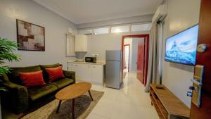 a living room with a couch and a table at Lekki FootPrint, Lekki Phase1 in Lekki