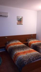 Postel nebo postele na pokoji v ubytování Hotel Bon Relax
