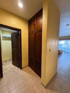 an empty room with a closet and a door at Hotel Manglares Celestun in Celestún +10 photos