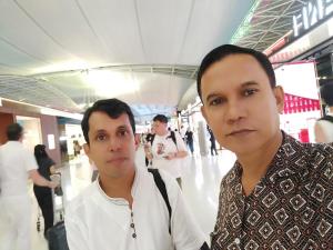 two people posing for a picture in a shopping mall at 251 jarvis street in Simrāil