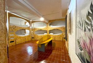 a room with a bench in the middle of it at Porto Santo Destination in Porto Santo +37 photos