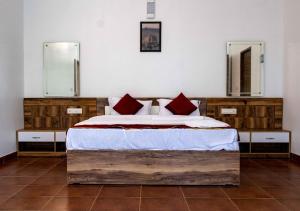 Postel nebo postele na pokoji v ubytování Lakkidi Mist Resort + 37 fotografií