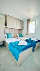Ένα ή περισσότερα κρεβάτια σε δωμάτιο στο Mobile Home Camp Dalmata Orebić