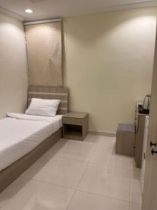 Postel nebo postele na pokoji v ubytování Al tawfeeg hotel - Al Azizyah + 37 fotografií