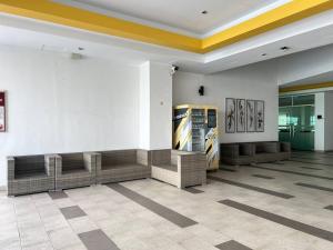a lobby of a store with couches and paintings at G Home 1 - Ipoh City Center Majestic 2R2B in Ipoh +40 photos