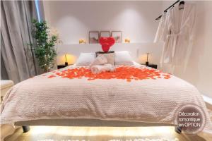 a bedroom with a bed with a stuffed animal on it at Riviera Bliss in Nice +7 photos