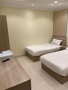 Postel nebo postele na pokoji v ubytování Al tawfeeg hotel - Al Azizyah
