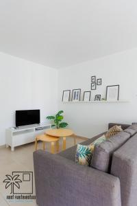 Televízia a/alebo spoločenská miestnosť v ubytovaní Coral Sun Corralejo iRent Fuerteventura