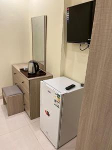 TV a/nebo společenská místnost v ubytování Al tawfeeg hotel - Al Azizyah