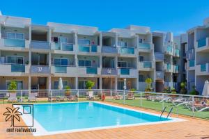 Bazén v ubytovaní Coral Sun Corralejo iRent Fuerteventura alebo v jeho blízkosti