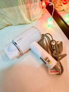 a white inhaler sitting on top of a table at Comfort Cozy landed House for Familiy 2room 8pax Bukit indah in Johor Bahru