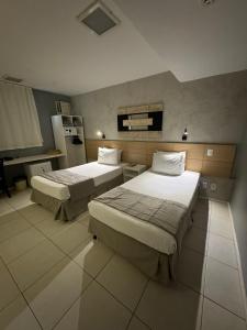 Postel nebo postele na pokoji v ubytování Grande Hotel Itaguaí