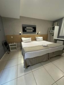 Postel nebo postele na pokoji v ubytování Grande Hotel Itaguaí