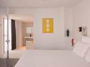 Postel nebo postele na pokoji v ubytování Hôtel Vertime