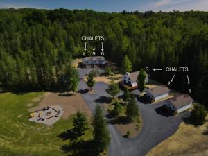 an aerial view of a campground in the middle of a forest at Chalet 2 OST Shefford in Shefford +4 photos