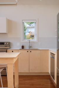 a kitchen with a sink and a window in it at Chalet 3 OST Shefford in Shefford