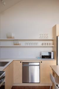 a kitchen with a stainless steel appliance in it at Chalet 3 OST Shefford in Shefford