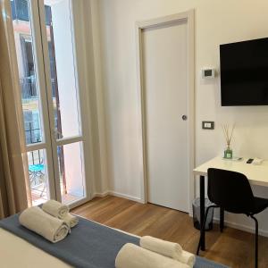 TV a/nebo společenská místnost v ubytování Sunrise Rooms
