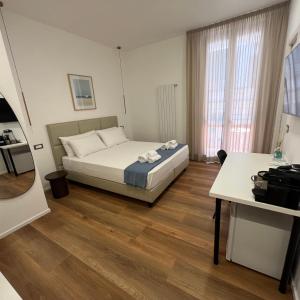 Postel nebo postele na pokoji v ubytování Sunrise Rooms