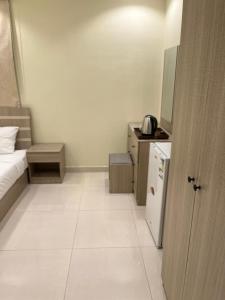 Kuchyň nebo kuchyňský kout v ubytování Al tawfeeg hotel - Al Azizyah