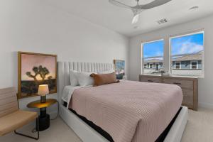 a bedroom with a large bed and a window at The Lagoon Neighbor condo in St. George