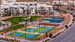 an artist rendering of a proposed apartment complex with tennis courts at The Lagoon Neighbor condo in St. George