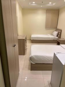 Postel nebo postele na pokoji v ubytování Al tawfeeg hotel - Al Azizyah