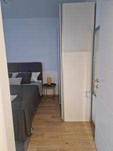 Postel nebo postele na pokoji v ubytování Apartman Panonija