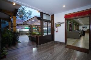 a lobby of a restaurant with the door open at Terrace Valley Hotel in Gangtok