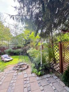 Fotografia z galérie ubytovania Tulipanek - domek letniskowy z ogródkiem v destinácii Stegna