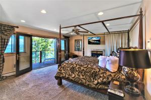 a hotel room with a bed and a television at Lx10 lakeview jewel of sierra theater , hot tub in Zephyr Cove