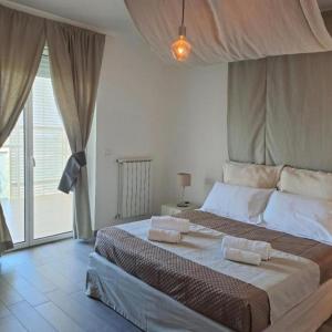 Postel nebo postele na pokoji v ubytování Airport Bari palese DELUXE 28
