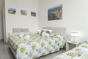 Postel nebo postele na pokoji v ubytování B&B VistaMare