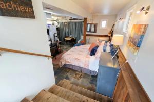 a bedroom with a bed and a desk in it at #StayinMyDistrict Hyde Park Down in Boise