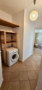 a bathroom with a washing machine in a room at APPARTAMENTO A DUE PASSI DAL MARE By VILLA FIORITA in Cattolica