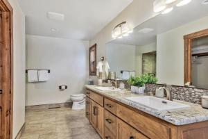 a bathroom with two sinks and a large mirror at LX33 Lake Tahoe Villa with Gameroom Hot tub Sauna in Zephyr Cove +35 photos