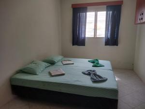Ένα ή περισσότερα κρεβάτια σε δωμάτιο στο Hostel da terê