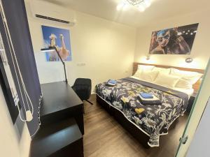 Ένα ή περισσότερα κρεβάτια σε δωμάτιο στο CASA BEACH CORAL OCEAN ViEW