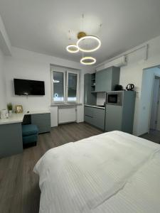 Η κουζίνα ή μικρή κουζίνα στο Central Suite +7 φωτογραφίες