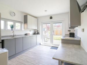 Køkken eller tekøkken på Jasmine Cottage