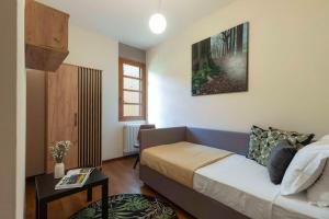 Postel nebo postele na pokoji v ubytování Villa Wright, ToscanaOneHH