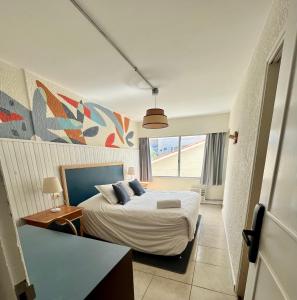 Cama ou camas em um quarto em ZAG Coliving Punta del este