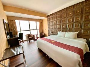 Ένα ή περισσότερα κρεβάτια σε δωμάτιο στο Luxury Inkari Hotel