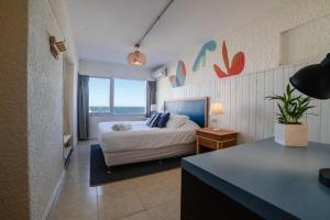 Cama ou camas em um quarto em ZAG Coliving Punta del este