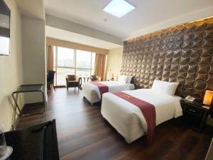Ένα ή περισσότερα κρεβάτια σε δωμάτιο στο Luxury Inkari Hotel